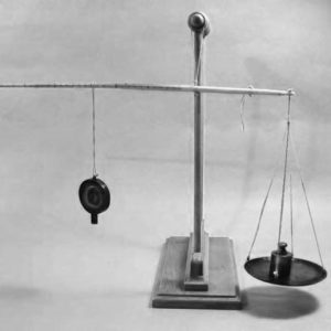 Antique Chinese steelyard balance.A steelyard balance is a straight beam balance with arms of unequal length. It incorporates a counterweight which slides along the calibrated longer arm to counterbalance the load and indicate its weight.This Chinese Balance is made of wood, at the end of the wood there is an iron hook (for hanging food or small items).