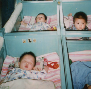 photo of several babies in cribs