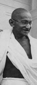 a photo of an old indian man in white robes