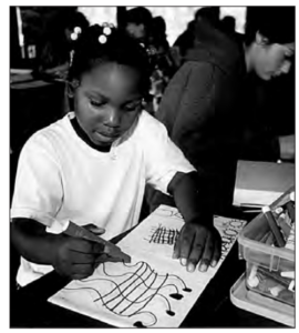 A girl drawing on white paper