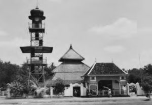 photo of a mosque next to a radio tower