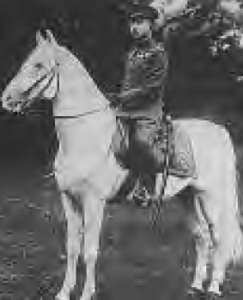 photo of a man in military uniform on a horse