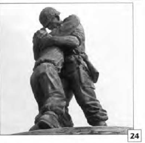 photo of a statue of two men in uniform embracing