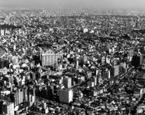 Aerial view of a large, densely packed, city. 