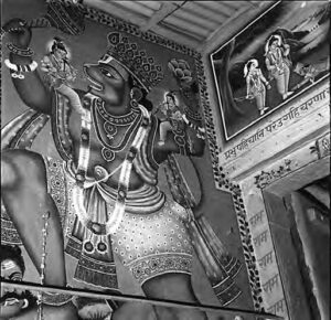 wall painting of a figure adorned in many necklaces