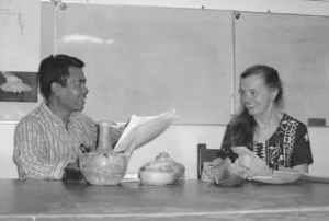 Preparing students for a week’s investigation in Bagan, Dr. Than Tun Maung shows a libation jar from a site he discovered near Dhammayangyi Temple.