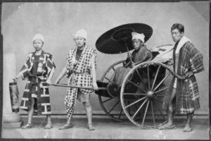 Studio photo of Meiji-era rickshaw pullers in typically individualistic attire, from National Museum of Denmark.