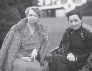 Soong Mei-Ling with First Lady Eleanor Roosevelt. Soong is wearing a traditional cheongsam and Roosevelt is wearing a dress with a fur coat.