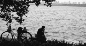 Photo of a person reading by  West Lake 
