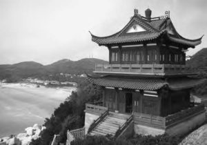 Photo of Buddhist temple surrounding by mountains