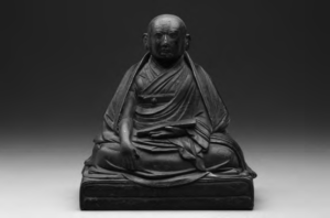 photo of a sitting monk statue