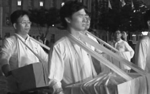 photo of men walking by with boxes