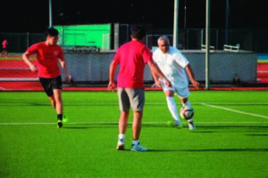 photo of people playing soccer