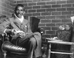 Photo of Gandhi sitting in the chair