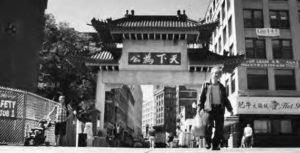 A man walks away from the Chinatown area in Boston. 