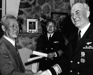 Syngman Rhee, president of the Republic of Korea (left), presents the ROK Order of Military Merit