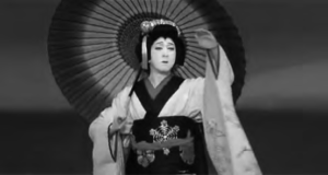 photo of a woman in kimono and umbrella. she has maiko makeup on.