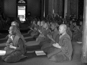 a room full of robed people sitting in rows