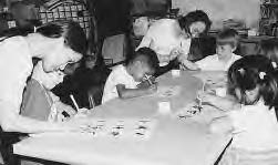 a group of children working on their writing