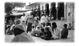 photo of several people in front of a shrine