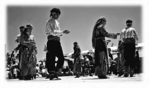 photo of several people performing in a festival