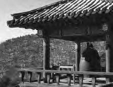 a photo of a bell under a pavilion