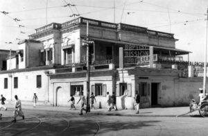 photo of people walking by a building