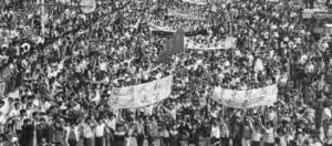 photograph of a huge crowd of people with signs