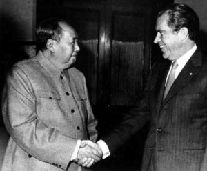 two men shake hands