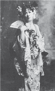 Image of a Western woman in traditional Japanese dress with a fan in her hand