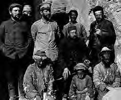 several weather-worn men pose for a photo