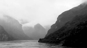 mountains can be seen through thick fog