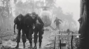 A wounded American GI supported by fellow soldiers. Source: Screen capture from episode 9 of the documentary The Vietnam War by Ken Burns and Lynn Novick. Available on Amazon Prime at https://tinyurl.com/yazfrtqu and on Netflix at https://tinyurl.com/yazfrtqu. © 2017 Vietnam Film Project, LLC.