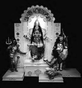 photo of a set with four dolls on a shrine like platform