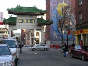 photo of a chinese gate among tall buildings
