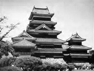 photograph of a castle with three different height sections.