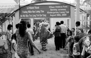 photo of many people walking through an entrance