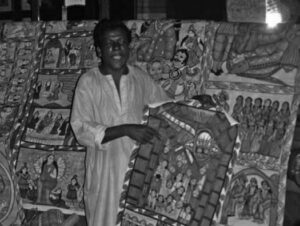 a man stands among elaborately designed scrolls