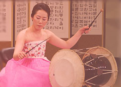 A Korean drummer performing on stage.