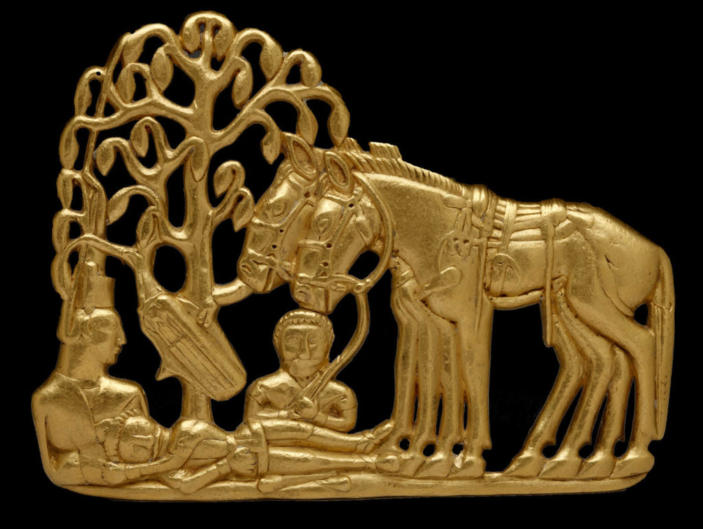 metal relief depicting two horses next to three people resting under a tree