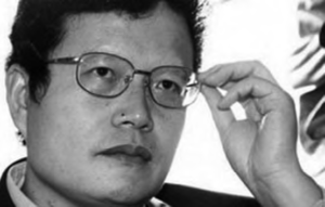 Photo of Zou Hengfu, a young man wearing glasses. 